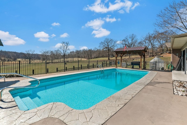 view of swimming pool with fence, a gazebo, a yard, a fenced in pool, and a patio area