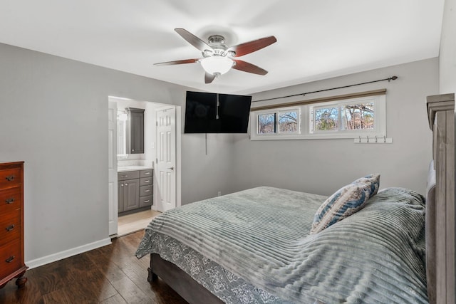 bedroom with ceiling fan, baseboards, wood-type flooring, and ensuite bath