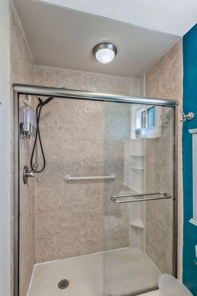 full bath featuring a shower stall