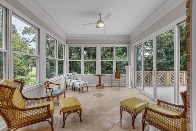 sunroom / solarium with a wealth of natural light and ceiling fan