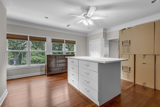 walk in closet featuring dark wood-type flooring and ceiling fan