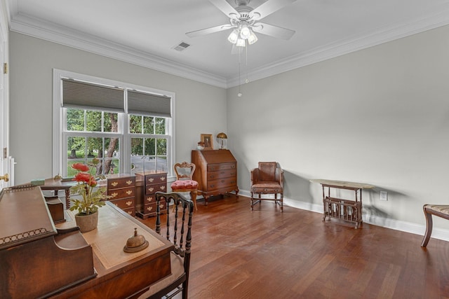 living area featuring visible vents, baseboards, ceiling fan, ornamental molding, and wood finished floors