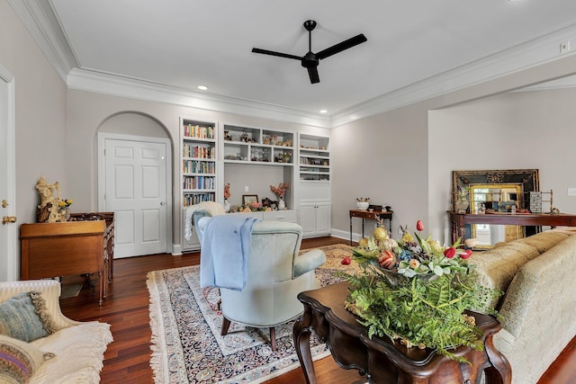 living area featuring built in shelves, crown molding, ceiling fan, recessed lighting, and wood finished floors