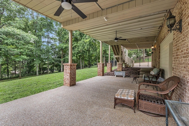 view of patio featuring ceiling fan, stairs, and fence