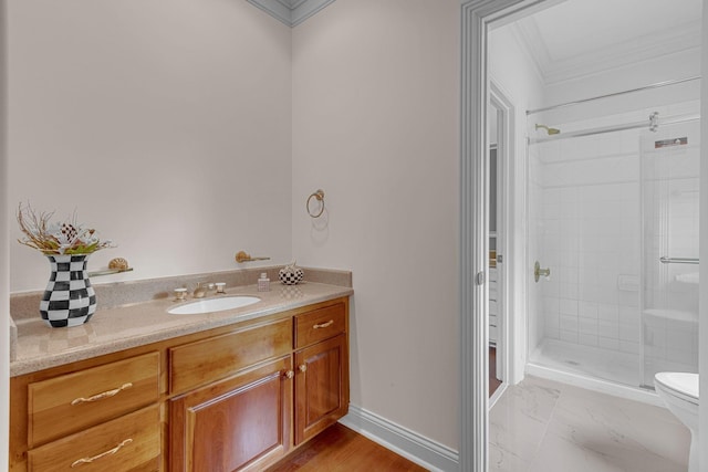 full bathroom with toilet, marble finish floor, a shower stall, baseboards, and vanity