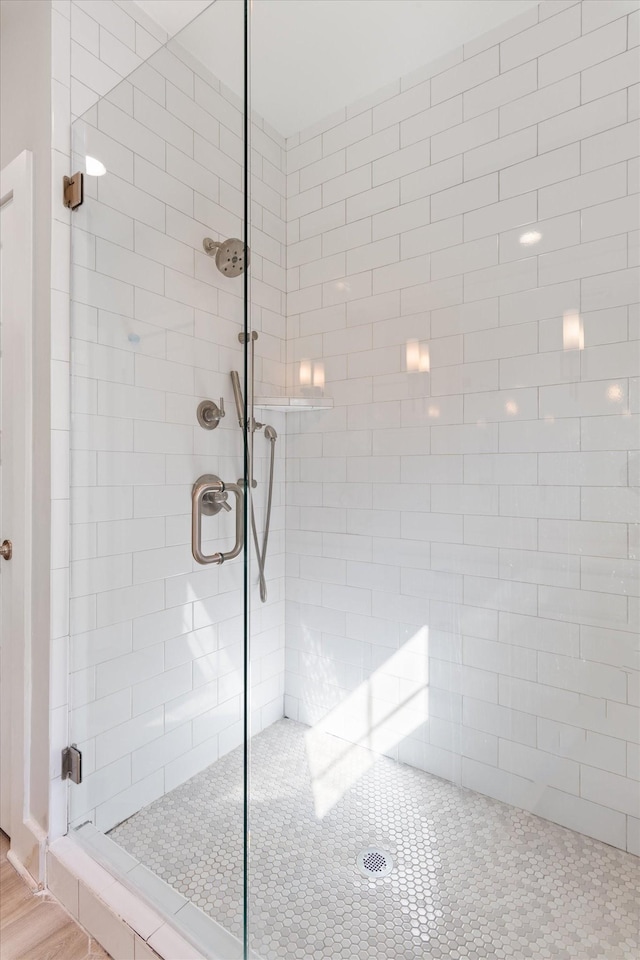 full bathroom with tiled shower