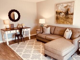 living area featuring wood finished floors and baseboards