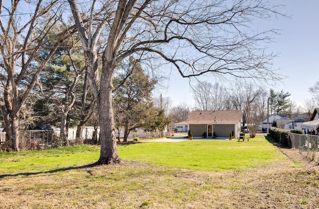 view of yard featuring a patio area and fence