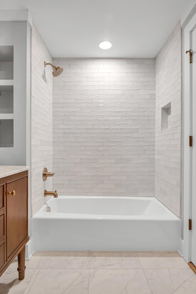 bathroom with shower / bath combination, marble finish floor, and vanity