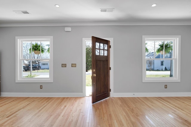 entryway with visible vents, baseboards, and a healthy amount of sunlight