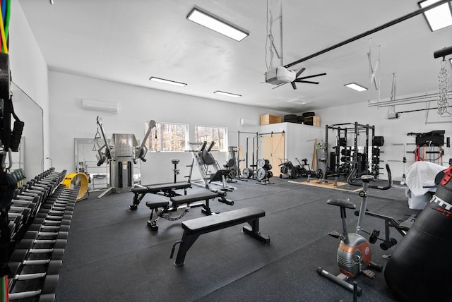 gym featuring an AC wall unit