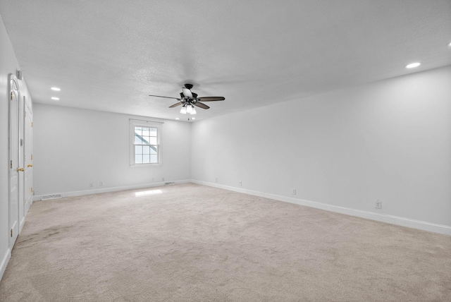 unfurnished room with recessed lighting, visible vents, light carpet, and ceiling fan