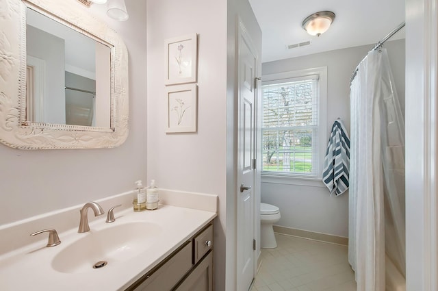 full bath with visible vents, toilet, tile patterned flooring, baseboards, and vanity