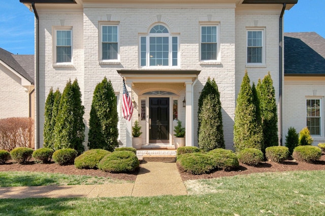 view of front facade featuring brick siding