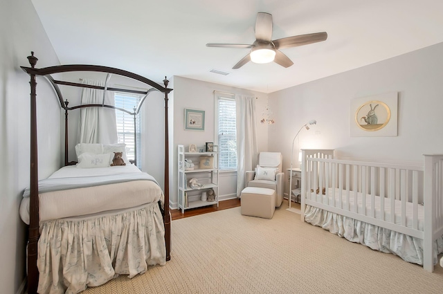 bedroom with visible vents and ceiling fan