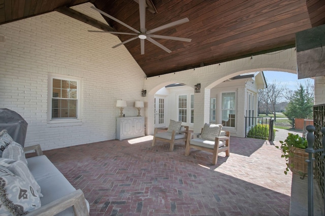 view of patio with outdoor lounge area, a grill, and ceiling fan