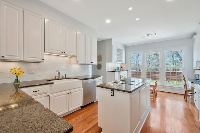 kitchen featuring dishwasher, black electric stovetop, light wood-style flooring, and white cabinetry