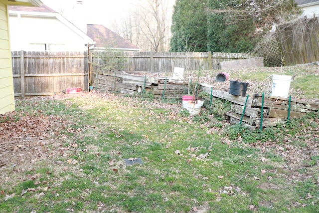 view of yard with a fenced backyard