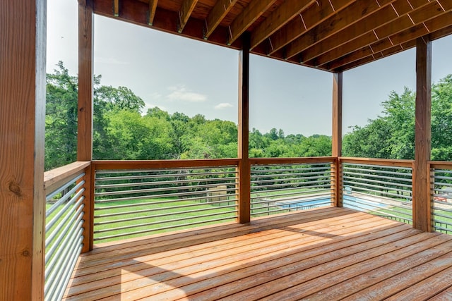 wooden deck with a view of trees