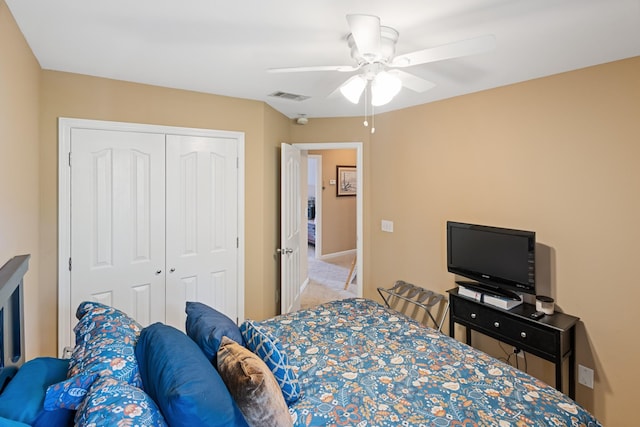 bedroom with a closet, visible vents, ceiling fan, and carpet floors