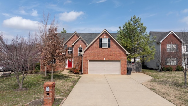 traditional home with driveway, a front yard, a shingled roof, a garage, and brick siding