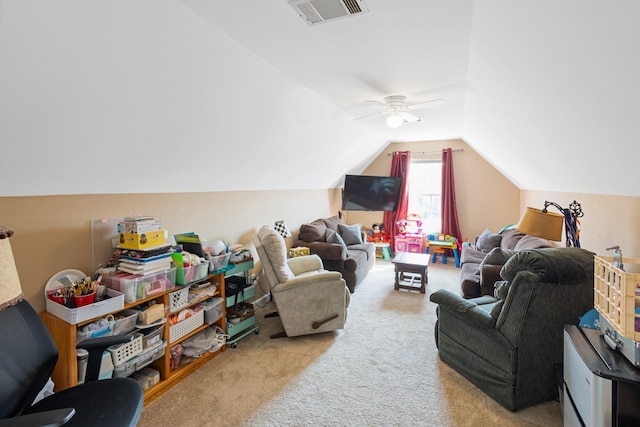 carpeted living room featuring lofted ceiling, a ceiling fan, and visible vents