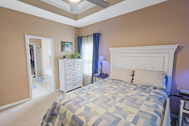 bedroom featuring carpet flooring, crown molding, a raised ceiling, and baseboards