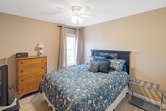 carpeted bedroom with baseboards and ceiling fan