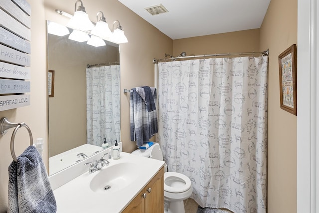 bathroom with visible vents, curtained shower, toilet, and vanity