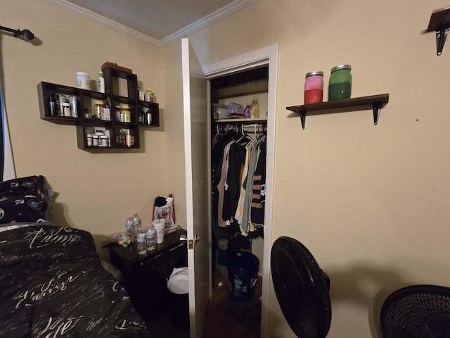 bedroom with a closet and ornamental molding