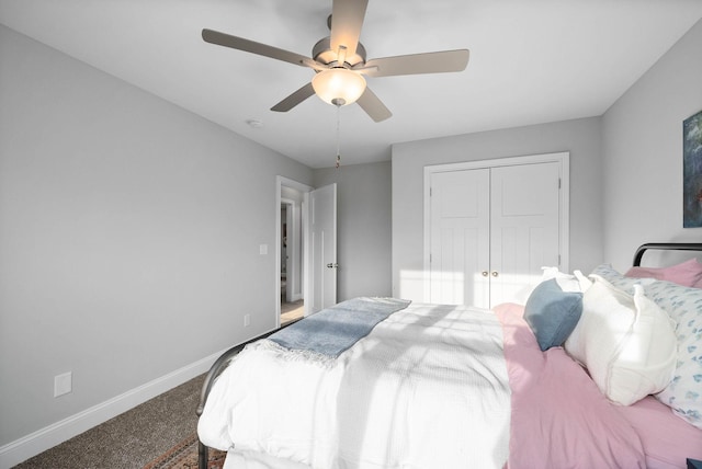 bedroom with a closet, baseboards, carpet floors, and ceiling fan