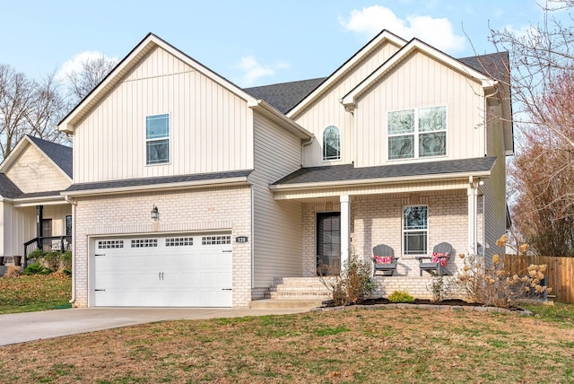 view of front of house with brick siding, fence, concrete driveway, covered porch, and an attached garage