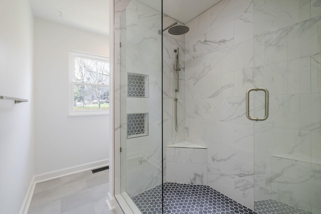 full bathroom with visible vents, baseboards, and a stall shower