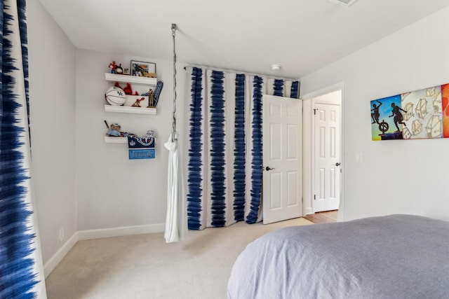 carpeted bedroom with baseboards