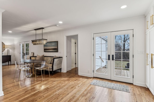 dining area featuring recessed lighting, light wood-style flooring, french doors, and baseboards