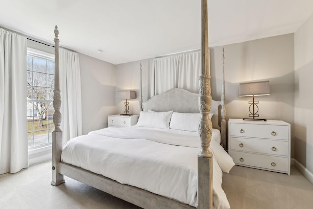 bedroom featuring light colored carpet