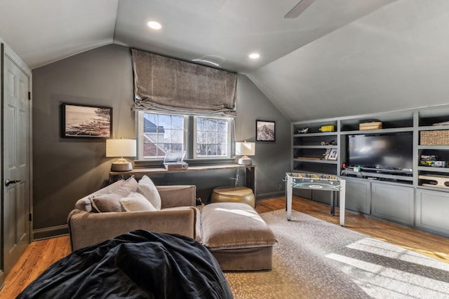 living room with wood finished floors, baseboards, recessed lighting, ceiling fan, and vaulted ceiling