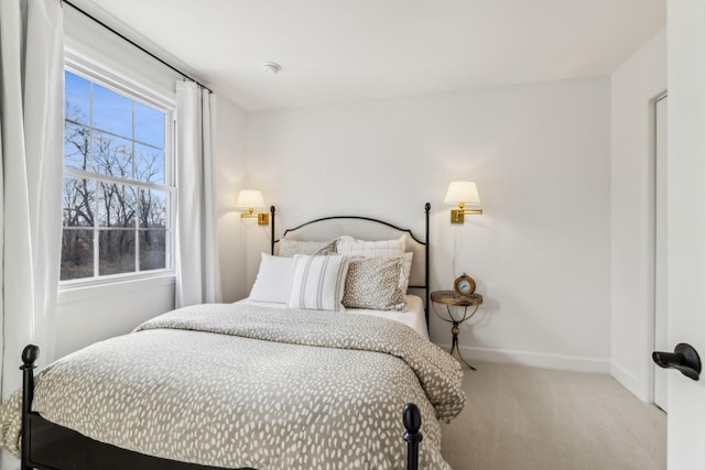 bedroom featuring baseboards and carpet floors