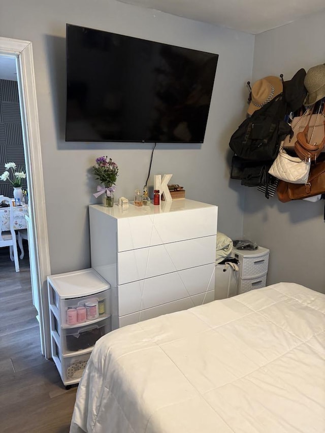 bedroom with wood finished floors