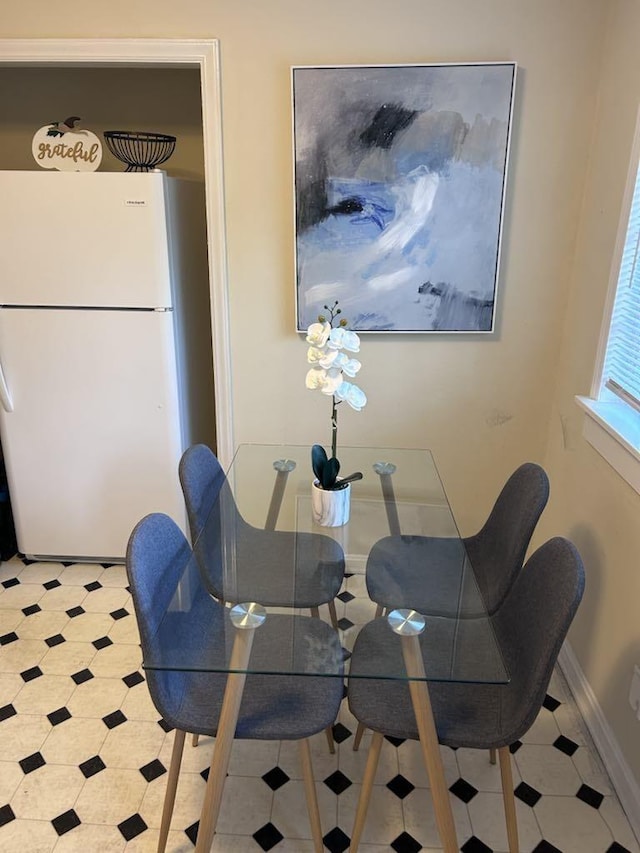 dining area featuring baseboards