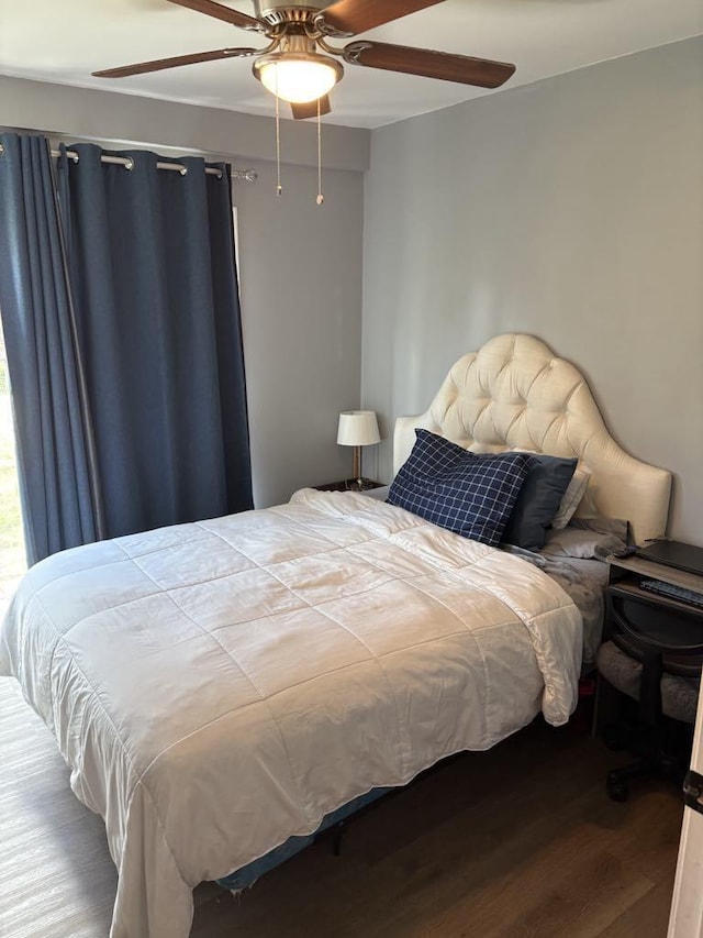 bedroom with ceiling fan and wood finished floors