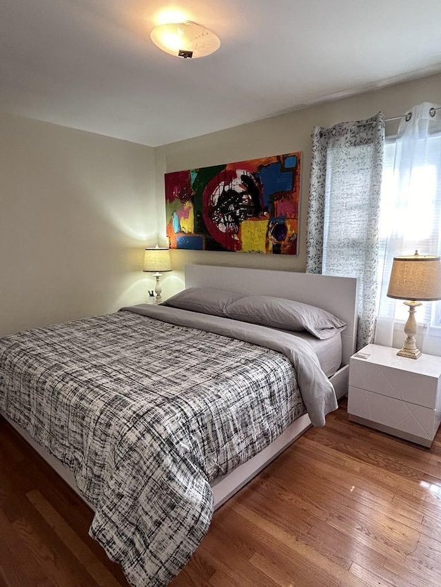 bedroom featuring wood finished floors