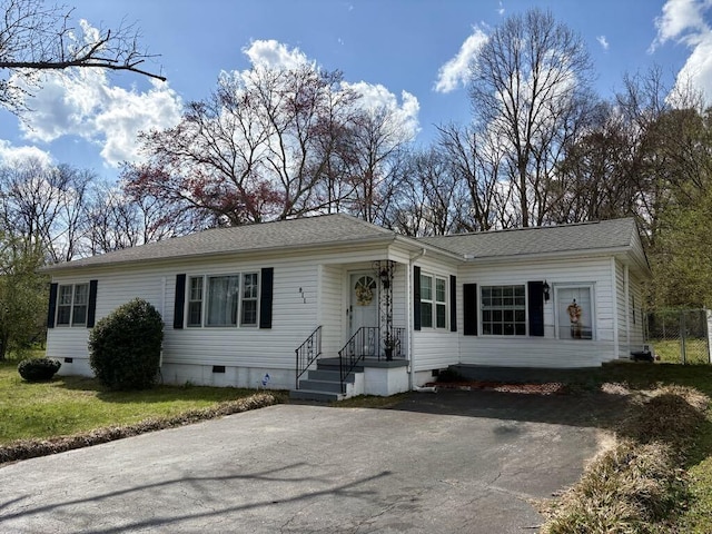 single story home with crawl space and a shingled roof