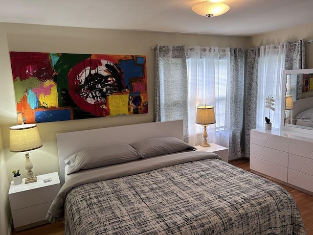 bedroom with wood finished floors