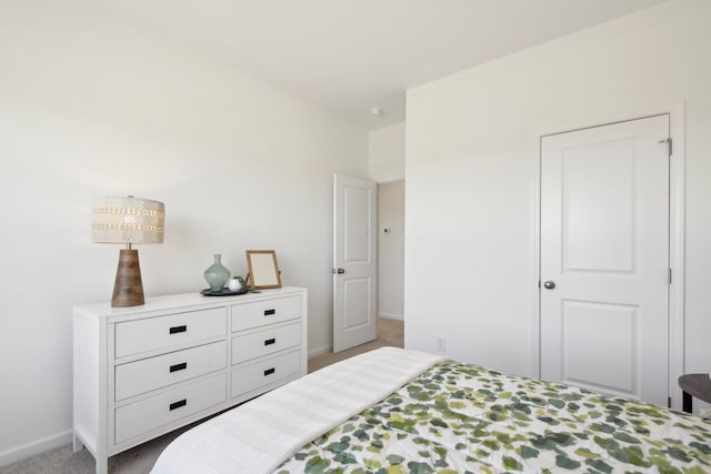 carpeted bedroom with baseboards