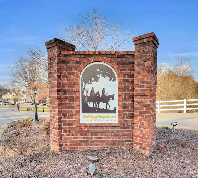 community sign with fence