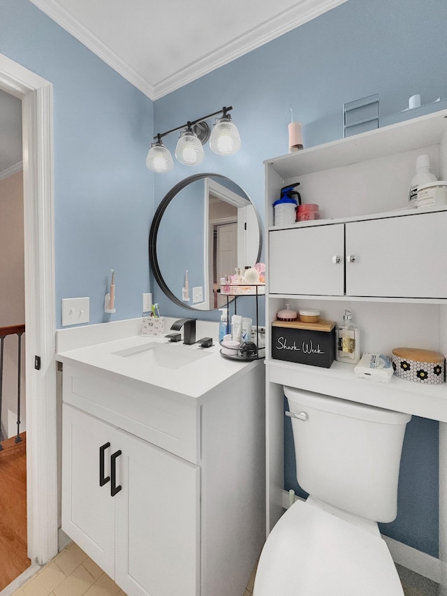 bathroom featuring vanity, toilet, and ornamental molding