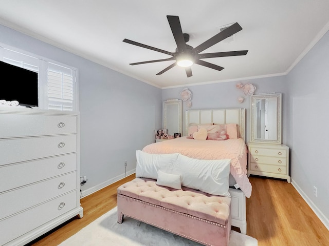 bedroom with a ceiling fan, light wood-style floors, baseboards, and ornamental molding