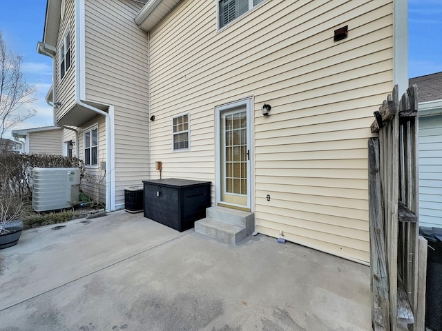 view of patio with entry steps and central AC unit