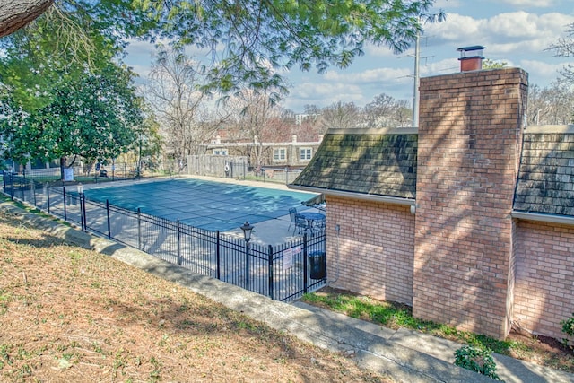 pool featuring a patio and fence